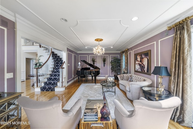 320 Sinclair Ct, Morganville, NJ 07751 - living room featuring a chandelier, stairs, crown molding, wood finished floors, and a decorative wall