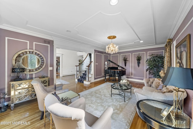 320 Sinclair Ct, Morganville, NJ 07751 - living area with stairway, a chandelier, a decorative wall, crown molding, and wood finished floors