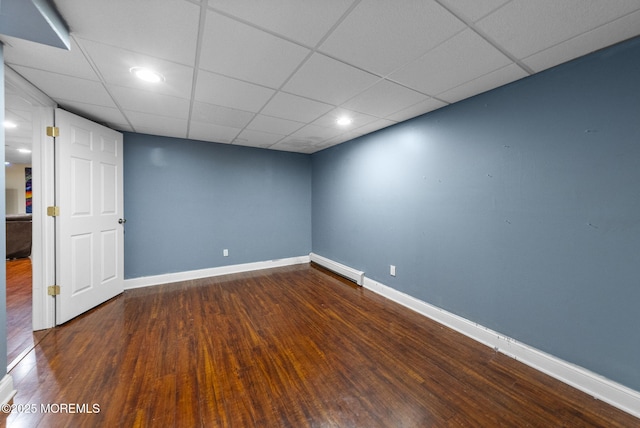 320 Sinclair Ct, Morganville, NJ 07751 - spare room with wood finished floors, a baseboard radiator, and a drop ceiling
