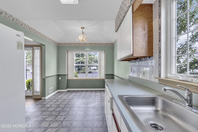 18 Stewart Ct, Jackson, NJ 08527 - kitchen featuring healthy amount of natural light, light countertops, white cabinets, and vaulted ceiling