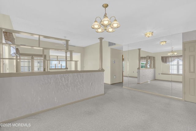18 Stewart Ct, Jackson, NJ 08527 - carpeted spare room with a chandelier and decorative columns
