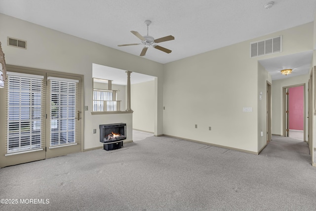 18 Stewart Ct, Jackson, NJ 08527 - unfurnished living room with carpet floors, ceiling fan, and a lit fireplace