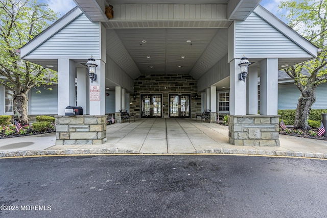 18 Stewart Ct, Jackson, NJ 08527 - property entrance with driveway, stone siding, and an attached carport