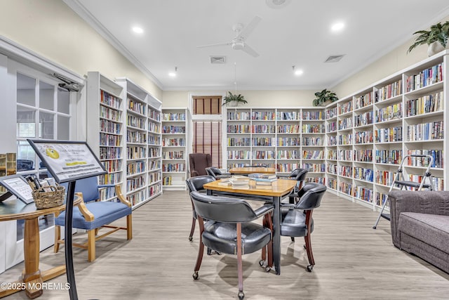 18 Stewart Ct, Jackson, NJ 08527 - living area with wall of books, crown molding, a ceiling fan, wood finished floors, and recessed lighting