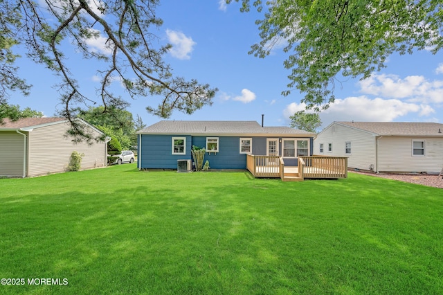 134 Northumberland Dr, Toms River, NJ 08757 - back of property with a wooden deck, a yard, and a sunroom