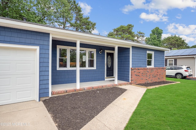 134 Northumberland Dr, Toms River, NJ 08757 - ranch-style home with a porch, brick siding, a front yard, and a garage