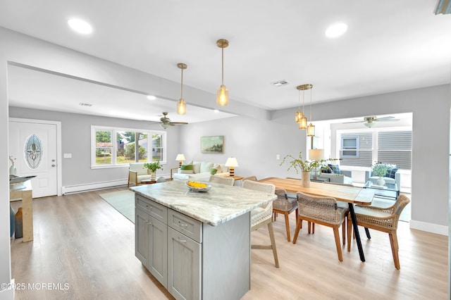 134 Northumberland Dr, Toms River, NJ 08757 - kitchen with gray cabinetry, a ceiling fan, baseboard heating, light wood-type flooring, and hanging light fixtures