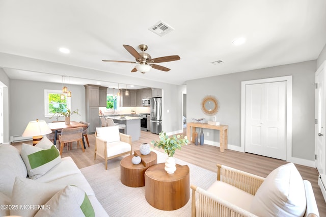 134 Northumberland Dr, Toms River, NJ 08757 - living area featuring a ceiling fan, light wood finished floors, recessed lighting, and baseboard heating