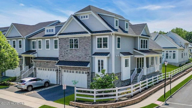 2 Foulks Ter, Lincroft, NJ 07738 - view of front of home with a standing seam roof, asphalt driveway, an attached garage, a metal roof, and stone siding