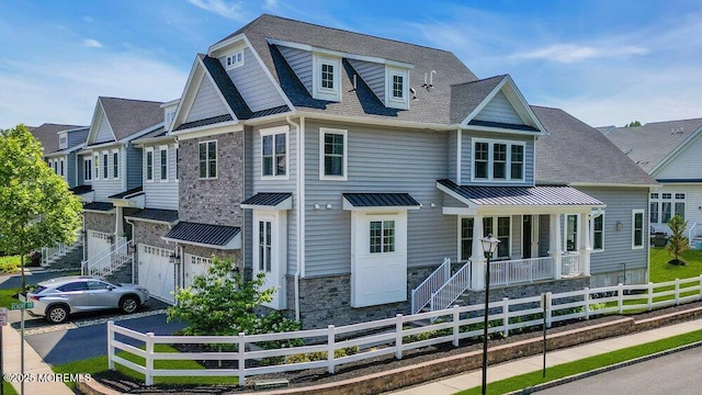 2 Foulks Ter, Lincroft, NJ 07738 - view of front of home featuring a standing seam roof, a porch, a metal roof, stone siding, and a garage