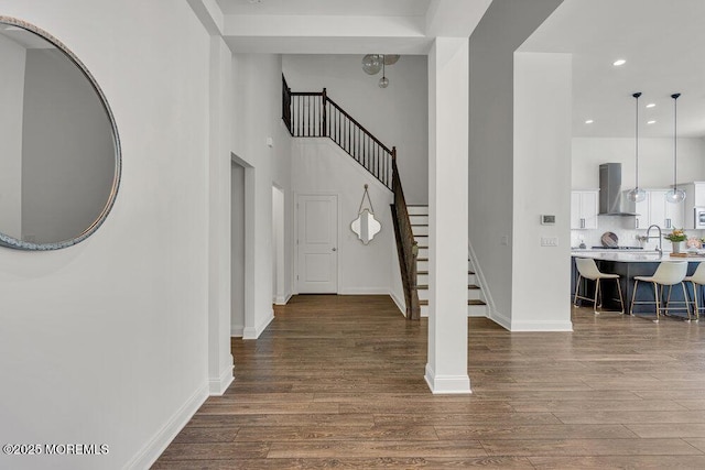 2 Foulks Ter, Lincroft, NJ 07738 - entrance foyer with dark wood finished floors, stairs, a high ceiling, and recessed lighting
