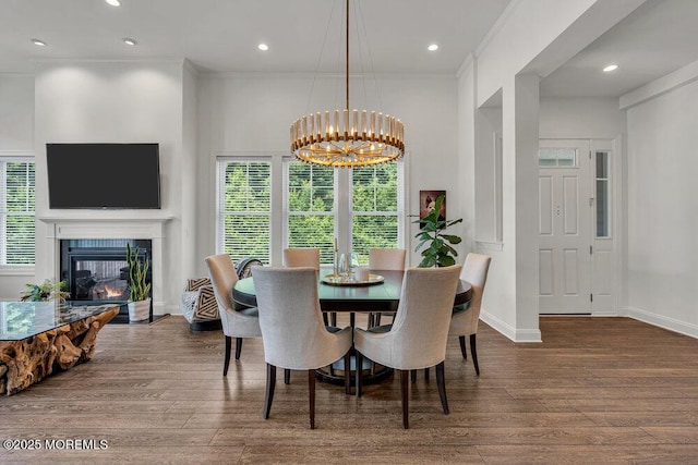 2 Foulks Ter, Lincroft, NJ 07738 - dining area with wood finished floors, a chandelier, a glass covered fireplace, crown molding, and recessed lighting