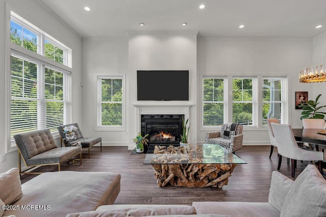 2 Foulks Ter, Lincroft, NJ 07738 - living area with healthy amount of natural light, ornamental molding, a glass covered fireplace, hardwood / wood-style floors, and recessed lighting