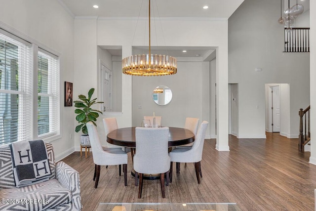 2 Foulks Ter, Lincroft, NJ 07738 - dining room featuring a chandelier, wood finished floors, crown molding, a towering ceiling, and recessed lighting