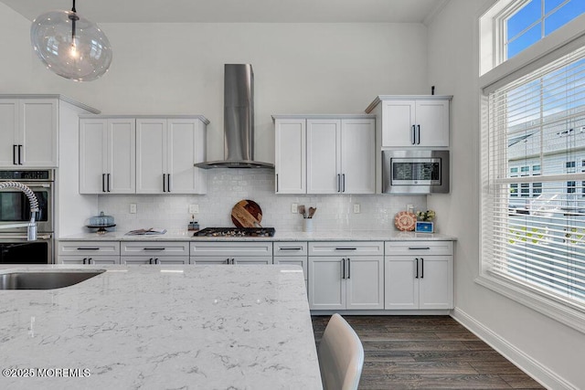 2 Foulks Ter, Lincroft, NJ 07738 - kitchen featuring wall chimney exhaust hood, appliances with stainless steel finishes, tasteful backsplash, and dark wood-style flooring