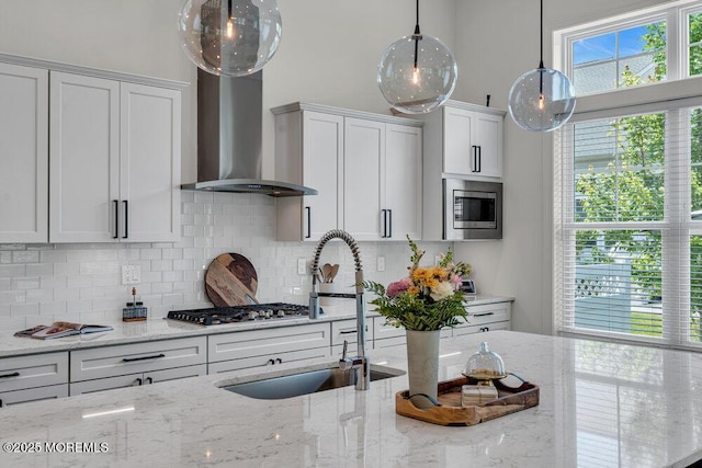 2 Foulks Ter, Lincroft, NJ 07738 - kitchen featuring wall chimney exhaust hood, stainless steel appliances, backsplash, light stone countertops, and a towering ceiling