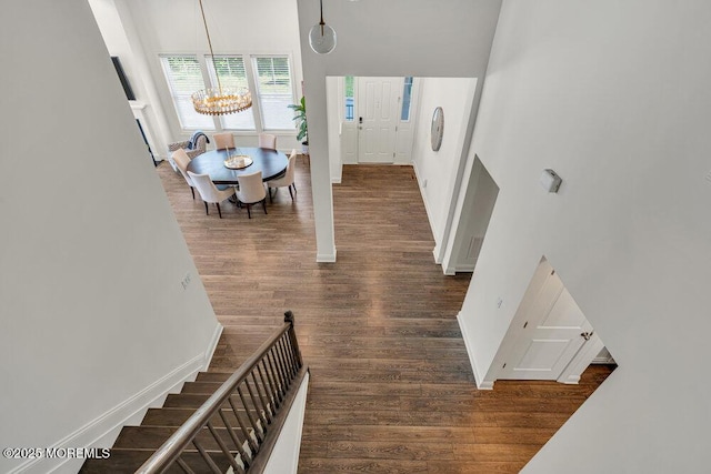 2 Foulks Ter, Lincroft, NJ 07738 - entryway featuring wood finished floors, a chandelier, stairway, and a high ceiling