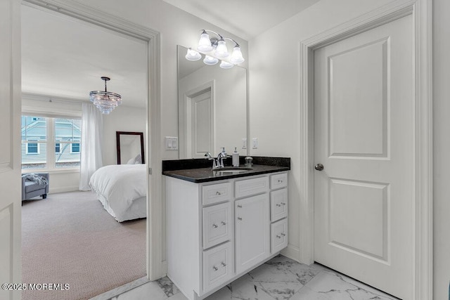 2 Foulks Ter, Lincroft, NJ 07738 - ensuite bathroom with vanity, marble look tiles, and a chandelier