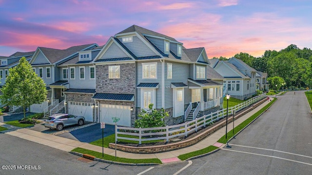 2 Foulks Ter, Lincroft, NJ 07738 - multi unit property with a standing seam roof, asphalt driveway, an attached garage, a metal roof, and stone siding