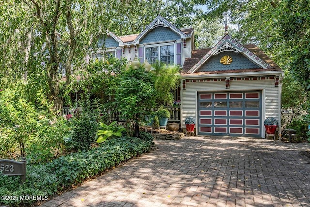 523 Pheasant Ln, Toms River, NJ 08753 - victorian house with decorative driveway and an attached garage
