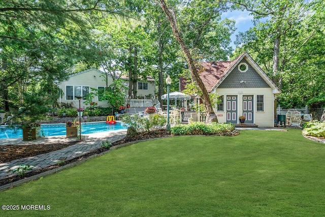 523 Pheasant Ln, Toms River, NJ 08753 - back of house with an outdoor pool, a yard, and a patio