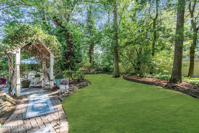 523 Pheasant Ln, Toms River, NJ 08753 - fenced backyard featuring a patio