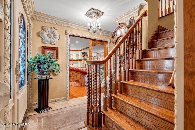 523 Pheasant Ln, Toms River, NJ 08753 - foyer with ornamental molding, a chandelier, and stairs