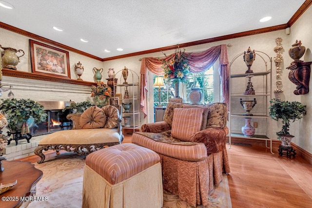 523 Pheasant Ln, Toms River, NJ 08753 - living area featuring a textured ceiling, ornamental molding, wood finished floors, and recessed lighting