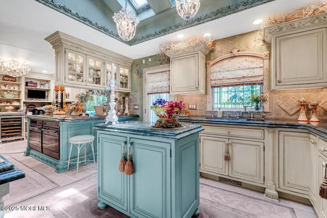 523 Pheasant Ln, Toms River, NJ 08753 - kitchen with cream cabinetry, wine cooler, a center island, a chandelier, and backsplash