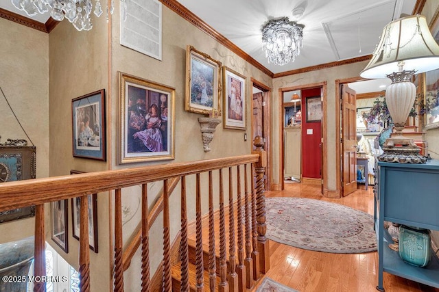 523 Pheasant Ln, Toms River, NJ 08753 - hall featuring wood finished floors, a chandelier, and ornamental molding