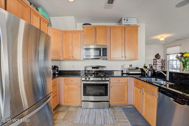 2 Michael Dr, Tinton Falls, NJ 07712 - kitchen with appliances with stainless steel finishes, dark stone countertops, and light brown cabinetry