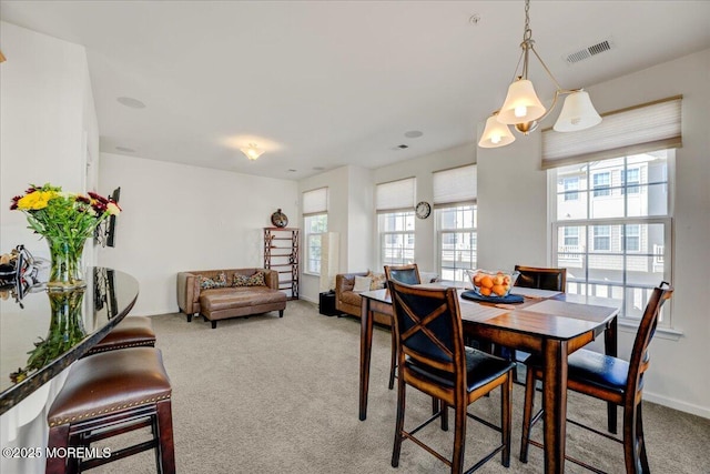 2 Michael Dr, Tinton Falls, NJ 07712 - carpeted dining room with healthy amount of natural light