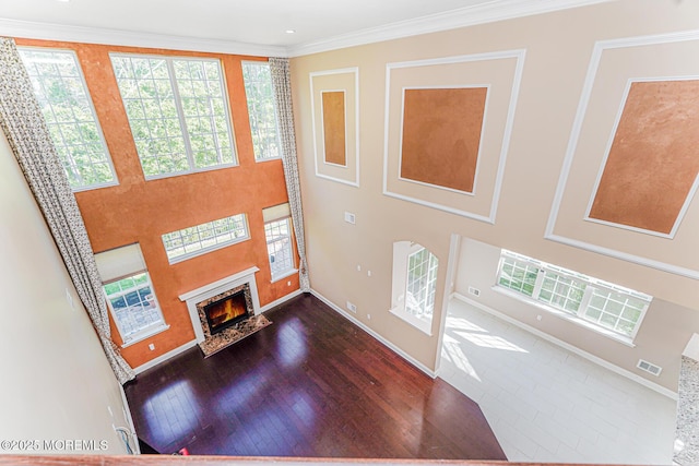 161 Arborridge Dr, Forked River, NJ 08731 - foyer featuring a fireplace with flush hearth, wood finished floors, and ornamental molding