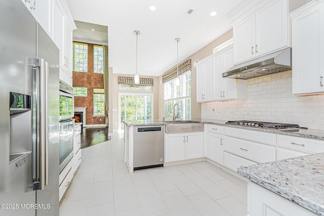 161 Arborridge Dr, Forked River, NJ 08731 - kitchen featuring appliances with stainless steel finishes, under cabinet range hood, recessed lighting, tasteful backsplash, and white cabinets