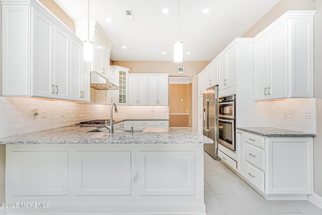161 Arborridge Dr, Forked River, NJ 08731 - kitchen featuring a peninsula, under cabinet range hood, decorative backsplash, appliances with stainless steel finishes, and recessed lighting