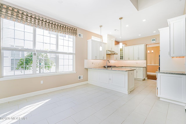 161 Arborridge Dr, Forked River, NJ 08731 - kitchen featuring backsplash, white cabinets, light stone countertops, a peninsula, and recessed lighting
