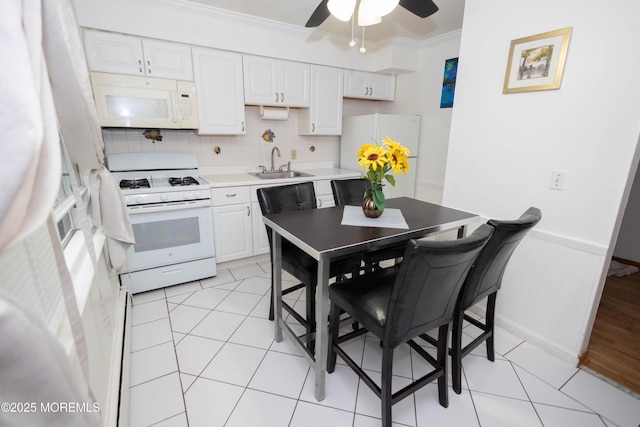 364 Westwood Ave Unit 7, Long Branch, NJ 07740 - kitchen with white appliances, ornamental molding, white cabinets, backsplash, and ceiling fan