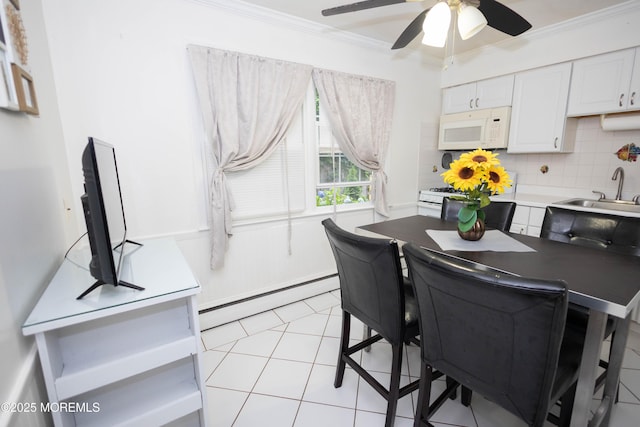 364 Westwood Ave Unit 7, Long Branch, NJ 07740 - dining room featuring ornamental molding, a baseboard heating unit, a ceiling fan, and light tile patterned floors