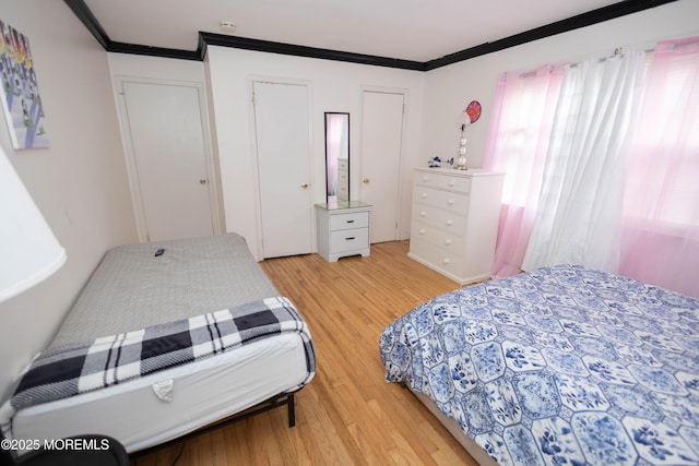 364 Westwood Ave Unit 7, Long Branch, NJ 07740 - bedroom featuring light wood-style floors and crown molding