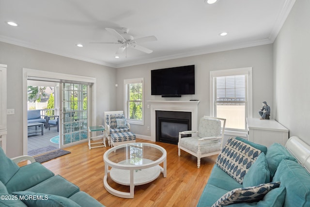 309 Hall Ave, Point Pleasant, NJ 08742 - living area with recessed lighting, wood finished floors, crown molding, ceiling fan, and a glass covered fireplace