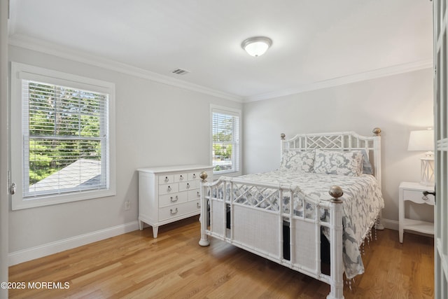 309 Hall Ave, Point Pleasant, NJ 08742 - bedroom featuring multiple windows, crown molding, and light wood-style floors