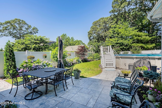 309 Hall Ave, Point Pleasant, NJ 08742 - fenced backyard with stairs, a patio area, and outdoor dining area