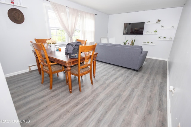 364 Westwood Ave Unit 46, Long Branch, NJ 07740 - dining area featuring wood finished floors and baseboard heating
