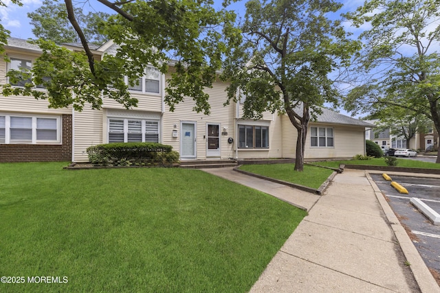 129 Tudor Ct, Lakewood, NJ 08701 - multi unit property featuring a front yard and uncovered parking