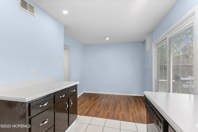 129 Tudor Ct, Lakewood, NJ 08701 - kitchen featuring light countertops, dark brown cabinets, wood finished floors, dishwashing machine, and recessed lighting