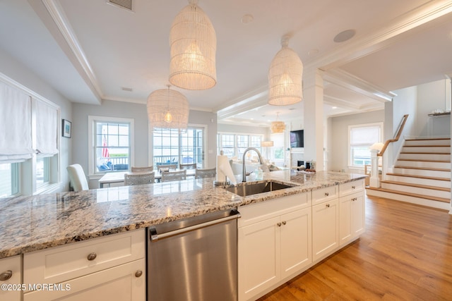2029 Bay Blvd, Ortley Beach, NJ 08751 - kitchen with dishwasher, light wood-style flooring, crown molding, light stone countertops, and white cabinets