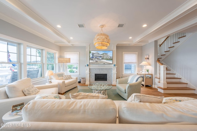 2029 Bay Blvd, Ortley Beach, NJ 08751 - living room featuring wood finished floors, healthy amount of natural light, stairway, crown molding, and a chandelier