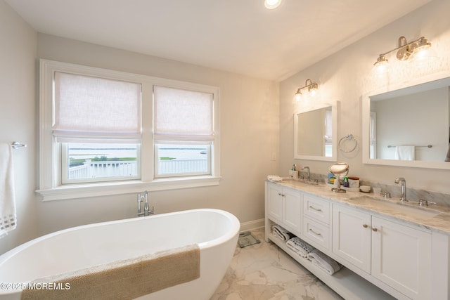 2029 Bay Blvd, Ortley Beach, NJ 08751 - bathroom with marble finish flooring, healthy amount of natural light, double vanity, a freestanding tub, and recessed lighting