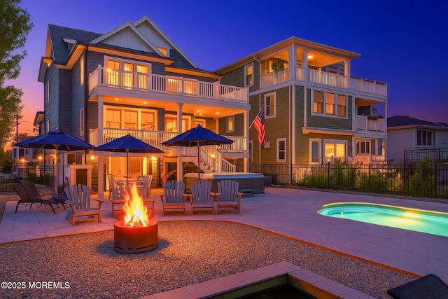 2029 Bay Blvd, Ortley Beach, NJ 08751 - back of house with a hot tub, a balcony, an outdoor fire pit, a patio area, and stairway