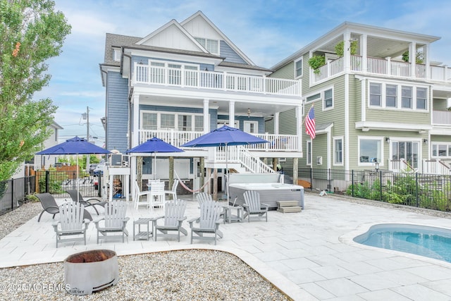 2029 Bay Blvd, Ortley Beach, NJ 08751 - rear view of property with a hot tub, a fenced backyard, a balcony, board and batten siding, and a patio
